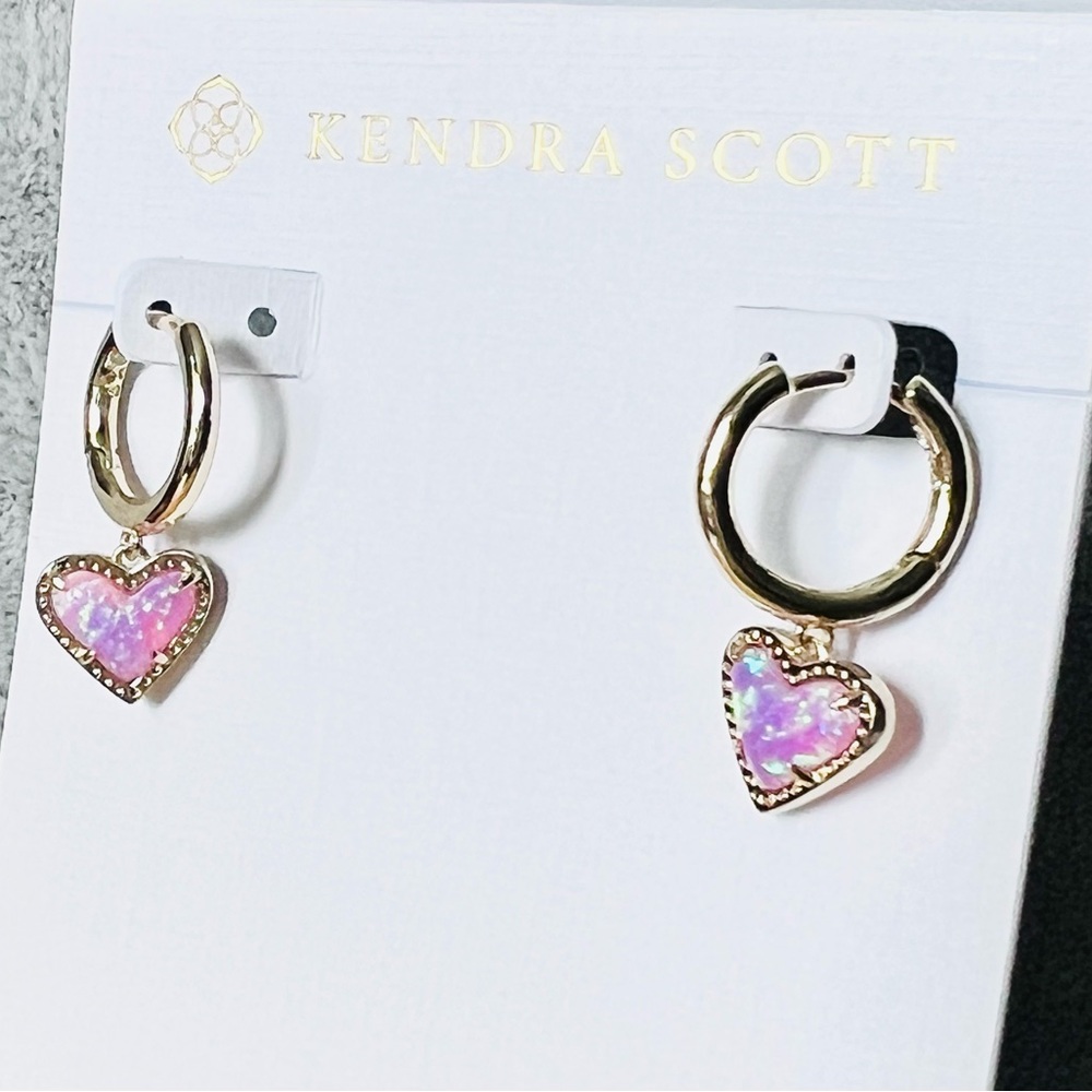Kendra Scott Ari Heart Huggie bubblegum Pink Kyocera Opal earrings in gold color